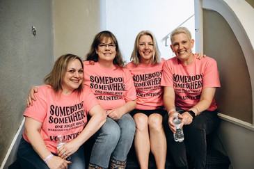 Stephanie Grynkiewicz (second from right) recruited friends Heather Augustine, Amy Rocky, and Lara Mellean-Reese to help at the May 28 Manhattan watch party. Photo credit Mary Vanier.