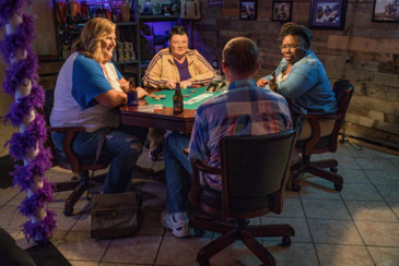 The friends enjoy a game at Fred’s underground poker palace. Photo by Matt Dinerstein/HBO.